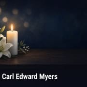 Fostoria News Memorial candle and lilies for Carl Edward Myers obituary.